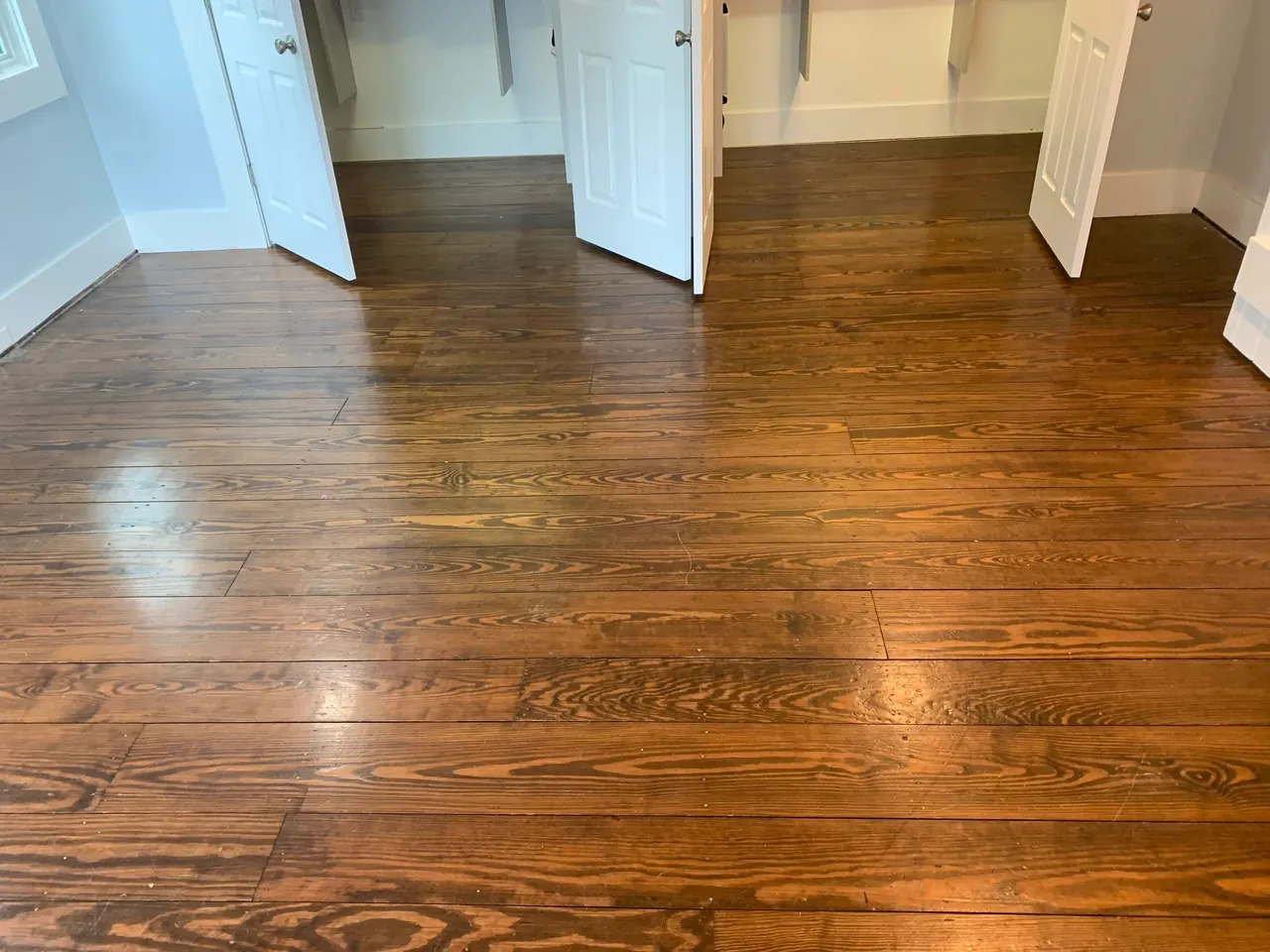 Close-up of refinished heart pine floorboards showing natural grain